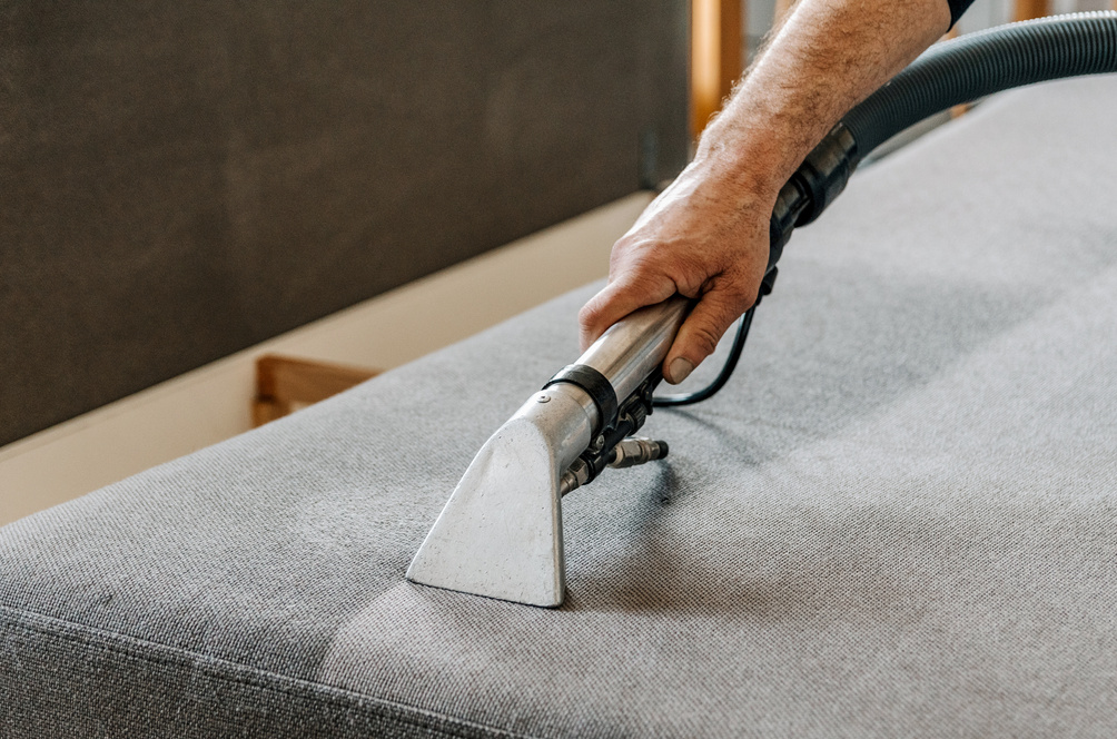 Professional cleaning service deep cleaning sofa at home.